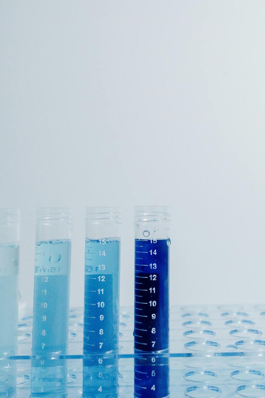three blue chemicals capsules 